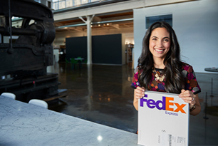 Woman holding a FedEx box