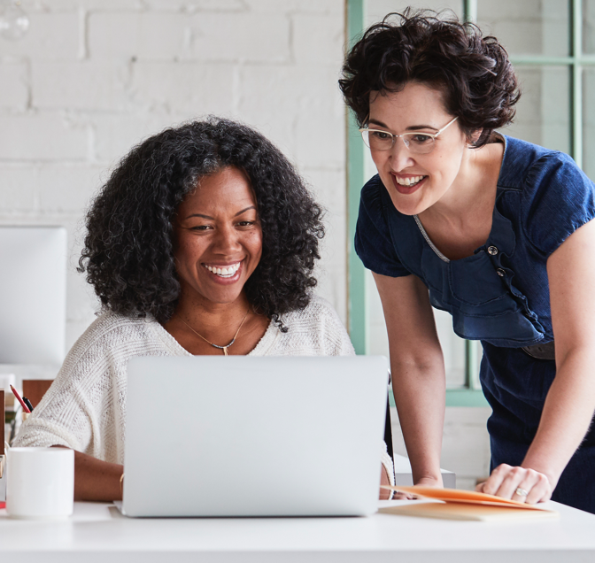 Two women with laptop